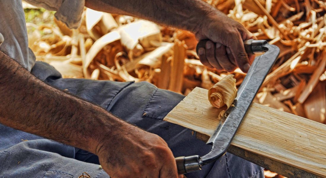 Woodworking using a hand plane in Vancouver