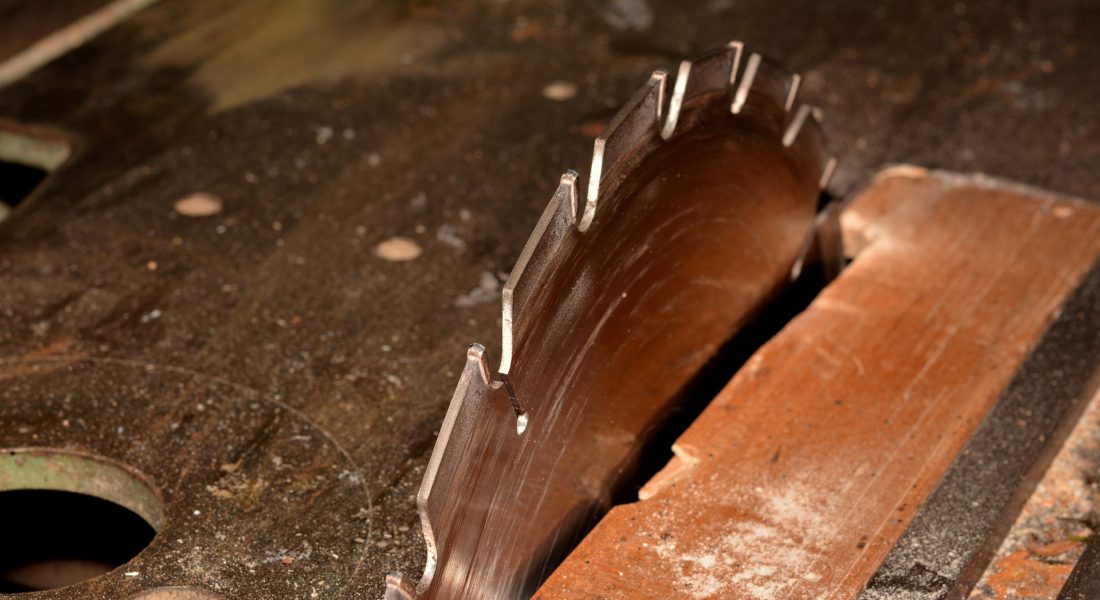 Saw blade cutting into wood